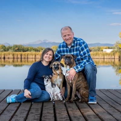 photo of man woman and 3 dogs in Ft Collins, CO.